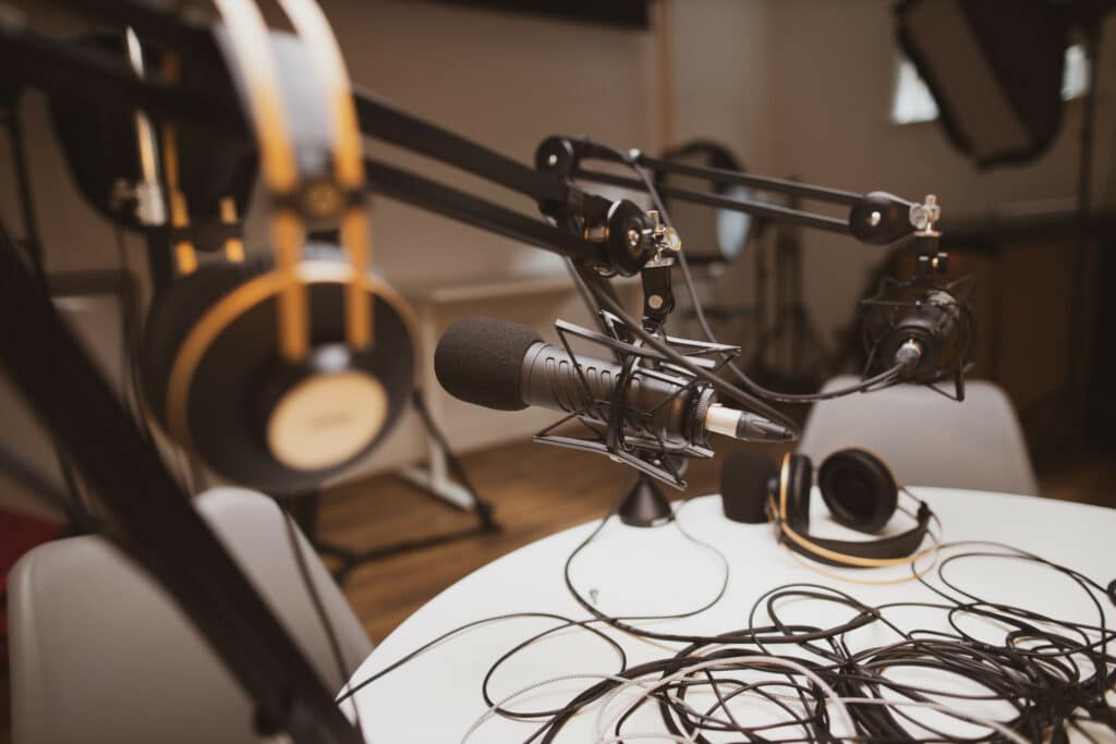 Podcast setup, desk, headphones, mics, etc